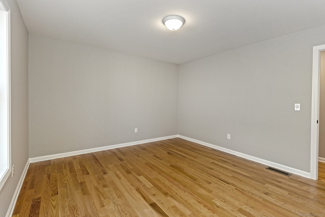 spare room with light hardwood / wood-style floors