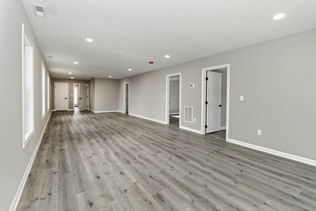 unfurnished living room with light hardwood / wood-style flooring