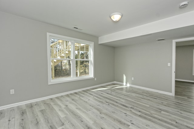 spare room featuring light wood-type flooring