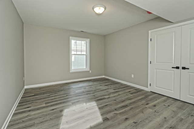 spare room featuring hardwood / wood-style floors