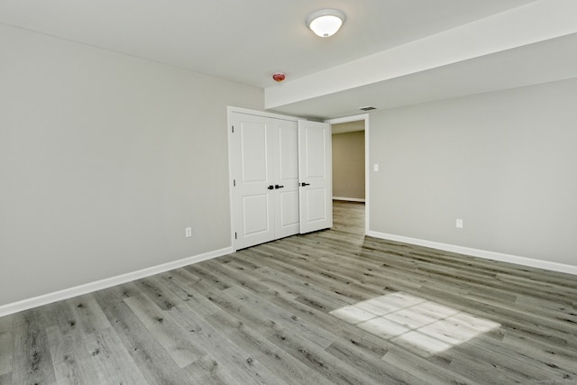 spare room featuring light wood-type flooring