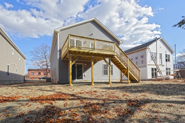 rear view of property with a wooden deck