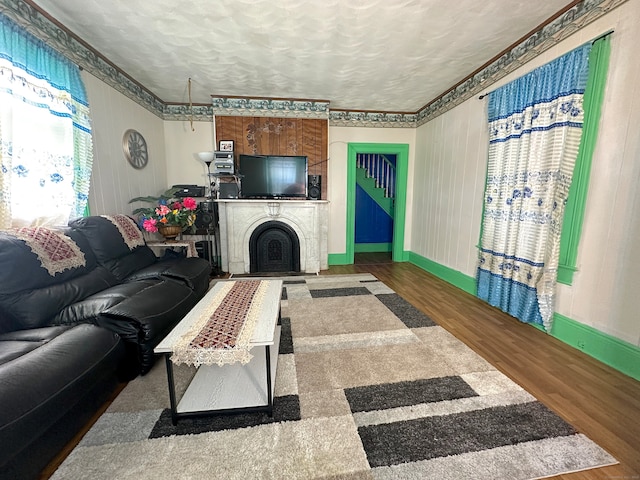 living room with hardwood / wood-style flooring and a textured ceiling