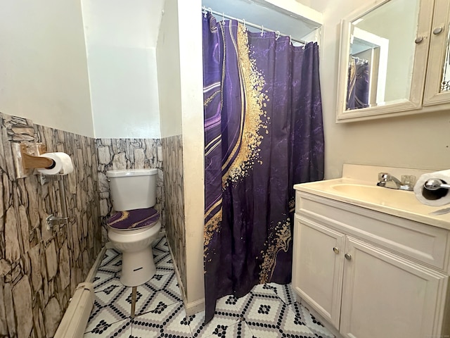 bathroom featuring tile walls, tile patterned floors, vanity, and toilet