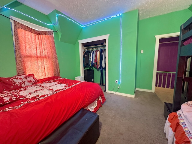 bedroom featuring a closet, carpet flooring, and a textured ceiling