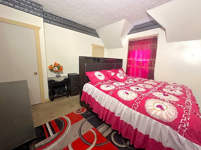 carpeted bedroom featuring a textured ceiling