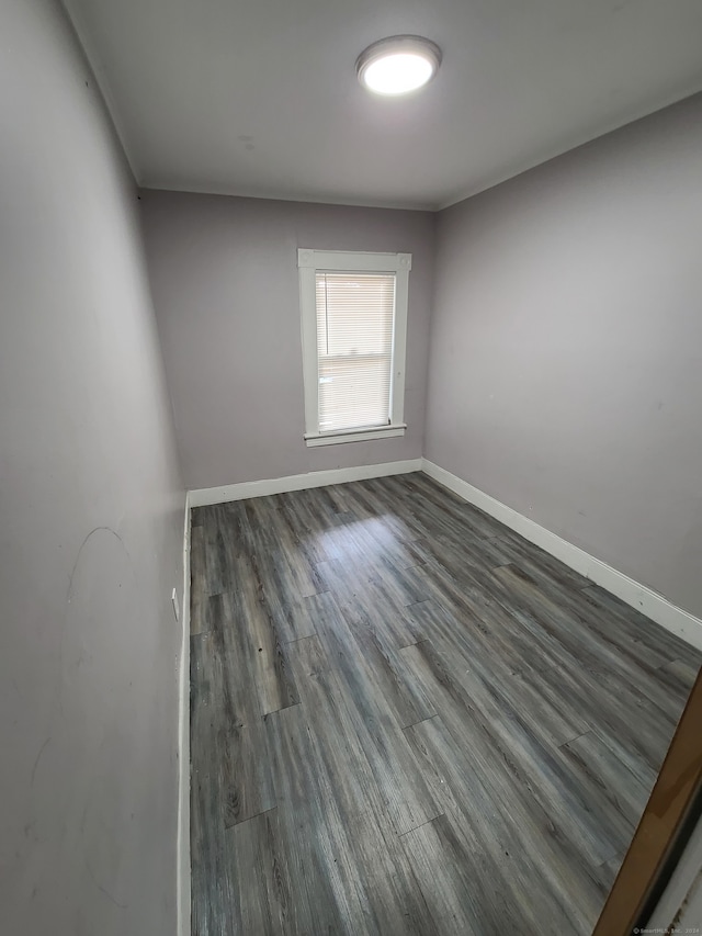 empty room featuring dark hardwood / wood-style flooring