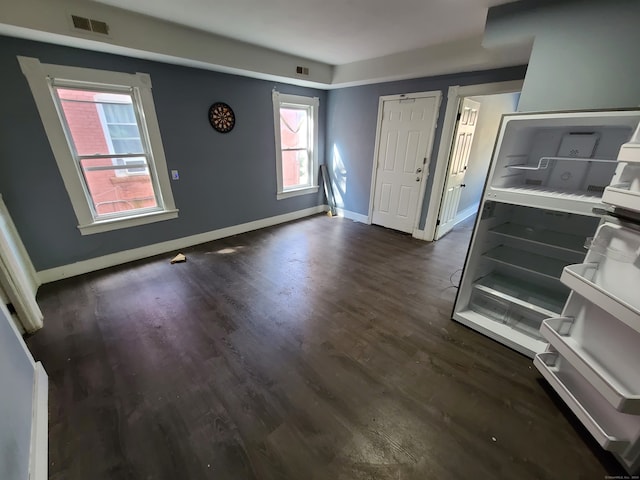 foyer with dark hardwood / wood-style floors