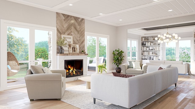 living room with light wood finished floors, a large fireplace, crown molding, and recessed lighting