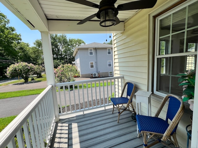 wooden deck featuring ceiling fan