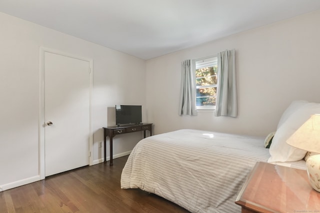 bedroom featuring dark hardwood / wood-style floors