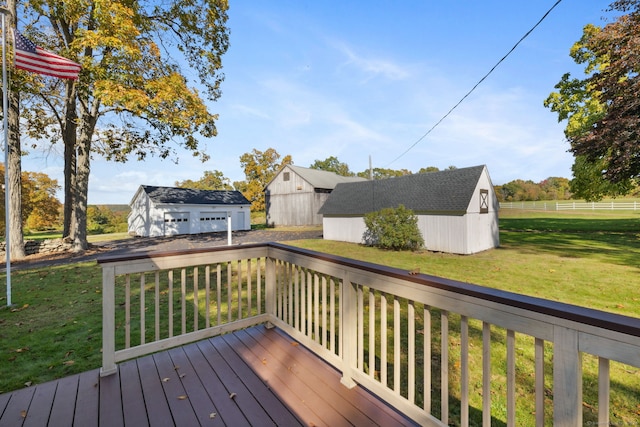 deck featuring an outbuilding and a lawn