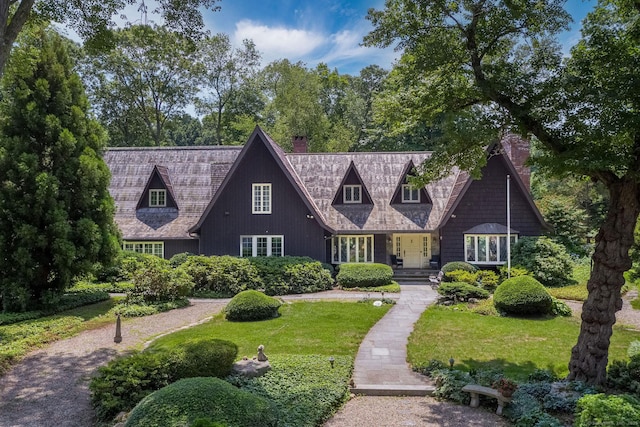 6 Tantummaheag Rd, Old Lyme, CT 06371 - view of front of house with a chimney and a front lawn