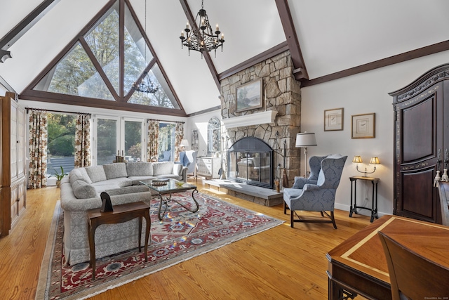 6 Tantummaheag Rd, Old Lyme, CT 06371 - living room featuring high vaulted ceiling, a chandelier, a stone fireplace, beamed ceiling, and light wood-style floors