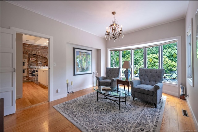6 Tantummaheag Rd, Old Lyme, CT 06371 - living area featuring a chandelier and light wood finished floors