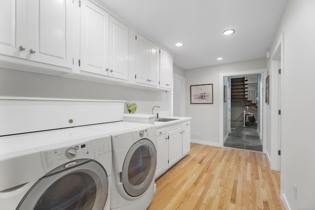 6 Tantummaheag Rd, Old Lyme, CT 06371 - laundry room featuring washing machine and dryer, recessed lighting, light wood finished floors, and cabinet space