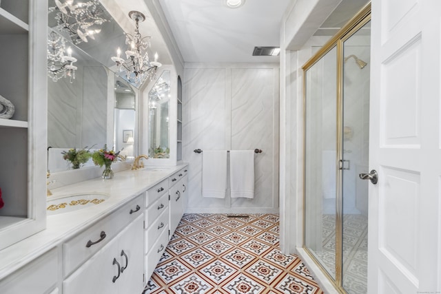 6 Tantummaheag Rd, Old Lyme, CT 06371 - bathroom featuring double vanity, a stall shower, a chandelier, and tile patterned floors