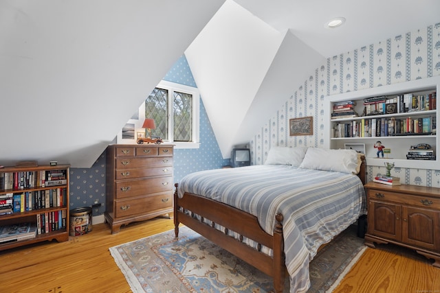6 Tantummaheag Rd, Old Lyme, CT 06371 - bedroom with wallpapered walls, wood finished floors, and lofted ceiling