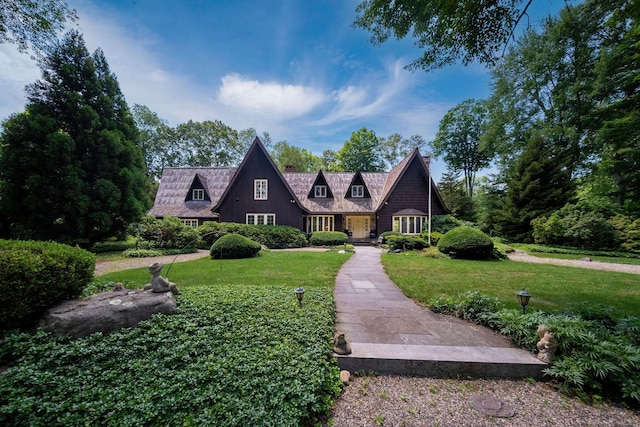 6 Tantummaheag Rd, Old Lyme, CT 06371 - view of front of house with a front lawn and a chimney