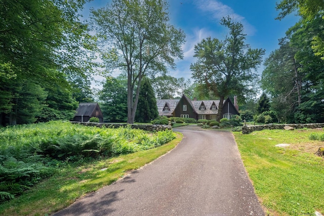 6 Tantummaheag Rd, Old Lyme, CT 06371 - a-frame style home with asphalt driveway and a chimney