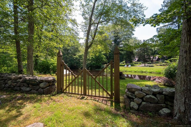 6 Tantummaheag Rd, Old Lyme, CT 06371 - gate with a lawn