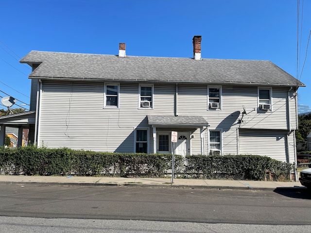 view of front of house featuring cooling unit