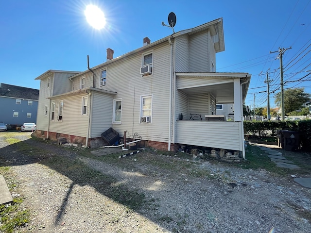 back of house with cooling unit