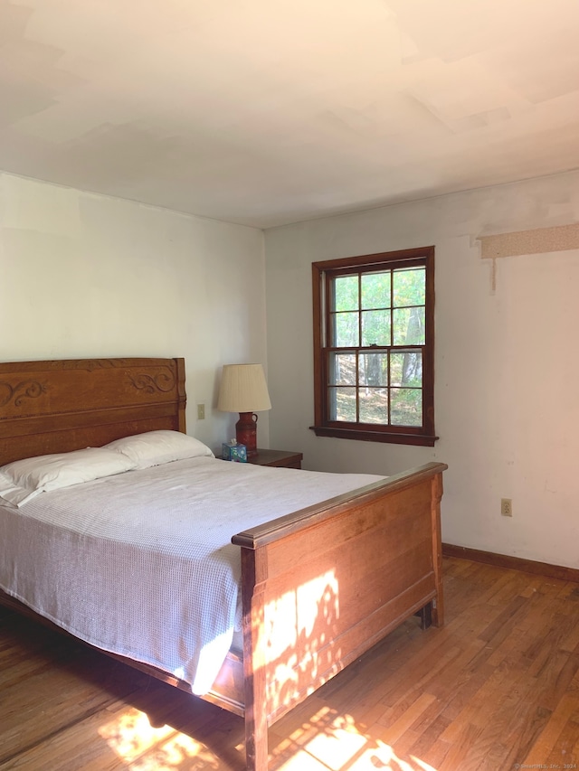 bedroom featuring dark hardwood / wood-style floors