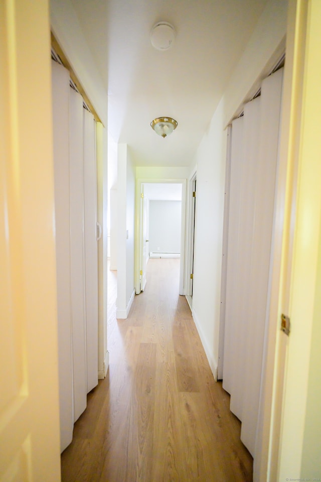 corridor featuring light hardwood / wood-style flooring