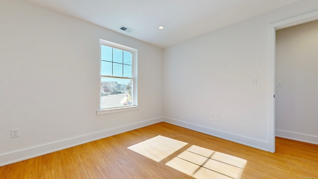 unfurnished room featuring light wood-type flooring