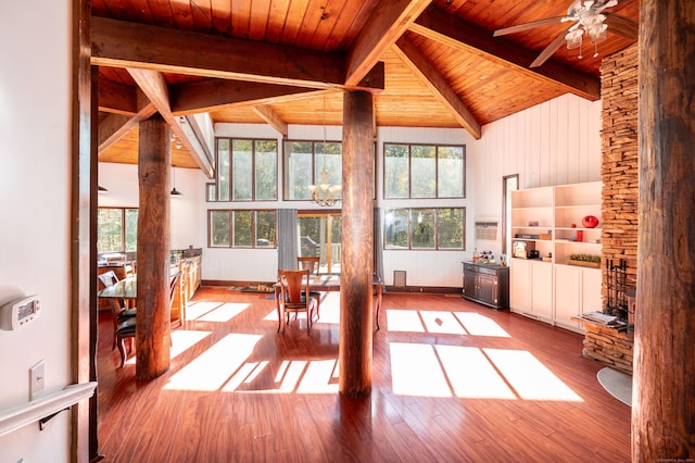 unfurnished sunroom featuring vaulted ceiling with beams, ceiling fan, wooden ceiling, and a wall unit AC