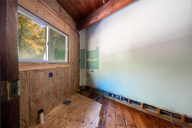 unfurnished room with wooden ceiling and wood-type flooring