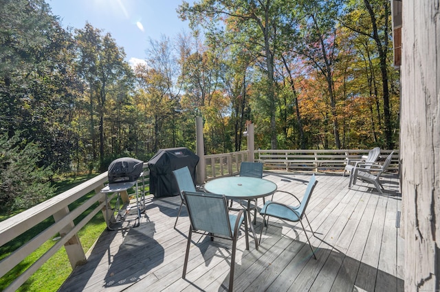 wooden terrace featuring grilling area