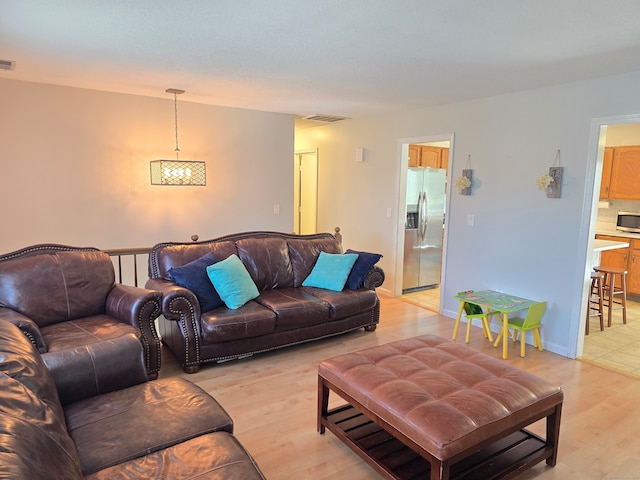 living room with light hardwood / wood-style floors