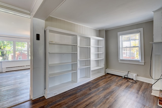 interior space featuring a baseboard radiator, crown molding, and dark wood-type flooring