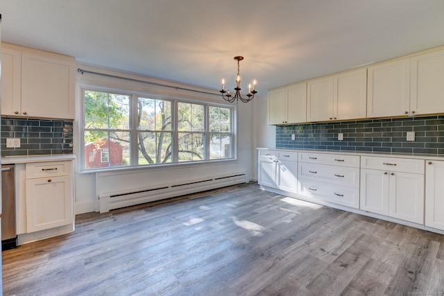 kitchen featuring light hardwood / wood-style floors, a wealth of natural light, and a baseboard radiator