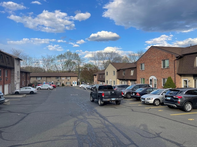 35 Mountain Village Rd Unit 8, Waterbury, CT 06706 - uncovered parking lot with a residential view