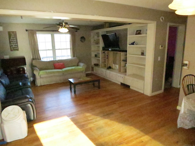 living room with hardwood / wood-style flooring and ceiling fan