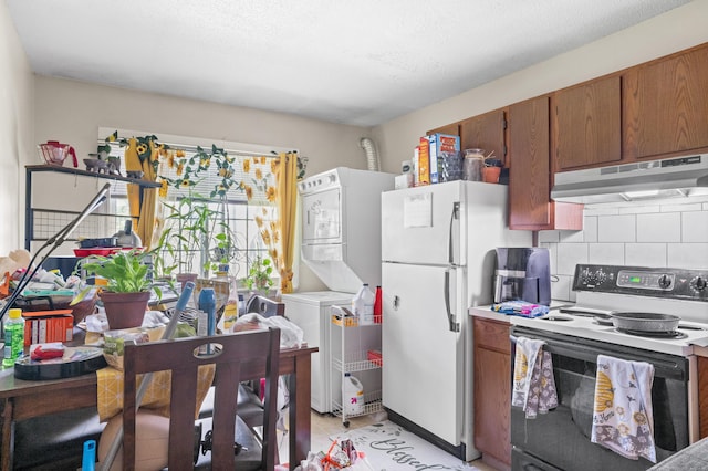 kitchen featuring backsplash, stacked washer / dryer, light tile patterned flooring, and white appliances