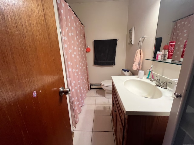 bathroom with vanity, tile patterned flooring, toilet, and a baseboard radiator