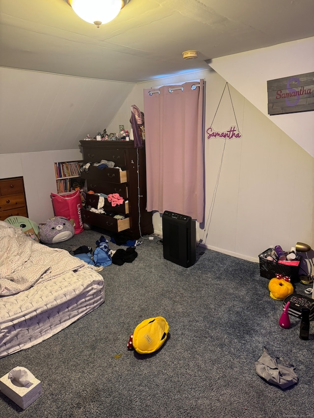 bedroom featuring vaulted ceiling and carpet floors