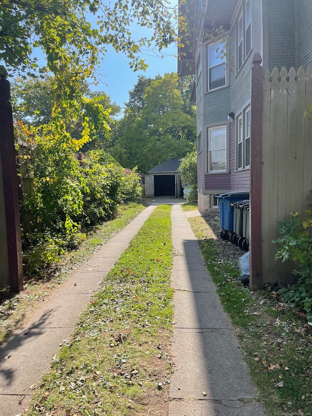 view of yard with a garage and an outdoor structure