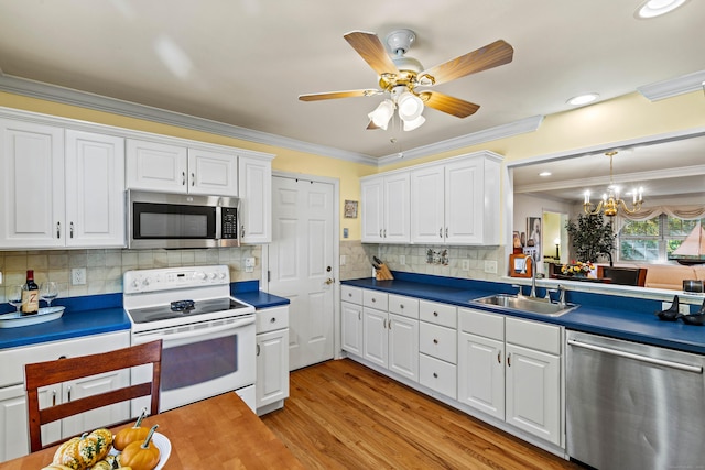 kitchen featuring white cabinetry, sink, and stainless steel appliances