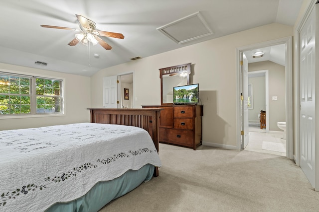 carpeted bedroom featuring connected bathroom, ceiling fan, and lofted ceiling