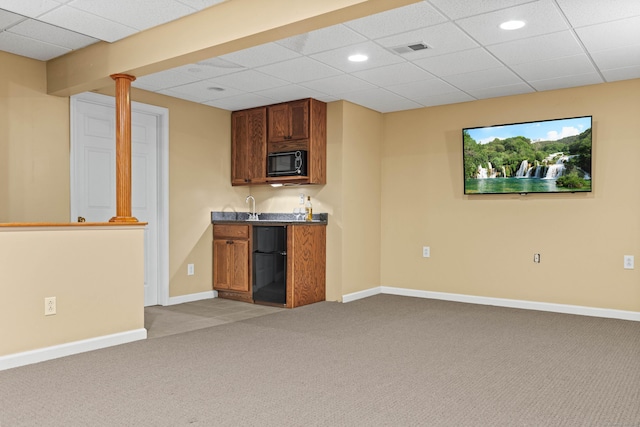 kitchen featuring refrigerator and carpet floors