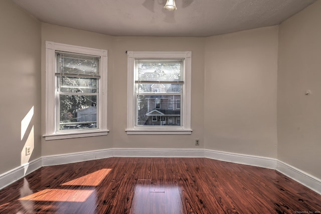 unfurnished room featuring hardwood / wood-style floors