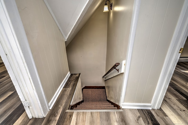 stairway featuring hardwood / wood-style flooring