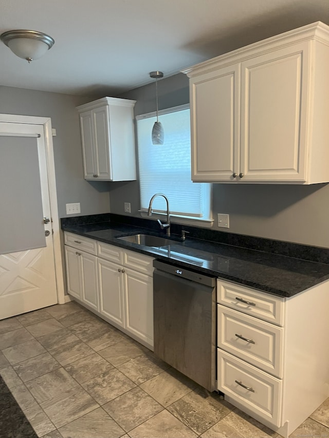 kitchen with sink, white cabinets, and stainless steel dishwasher