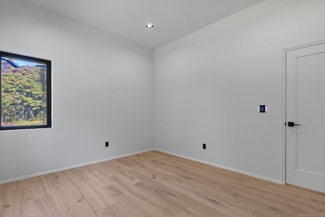 spare room featuring light hardwood / wood-style floors