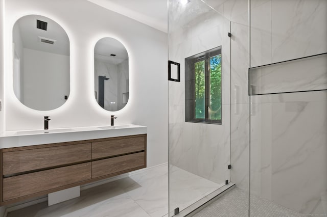 bathroom with a shower with door and vanity